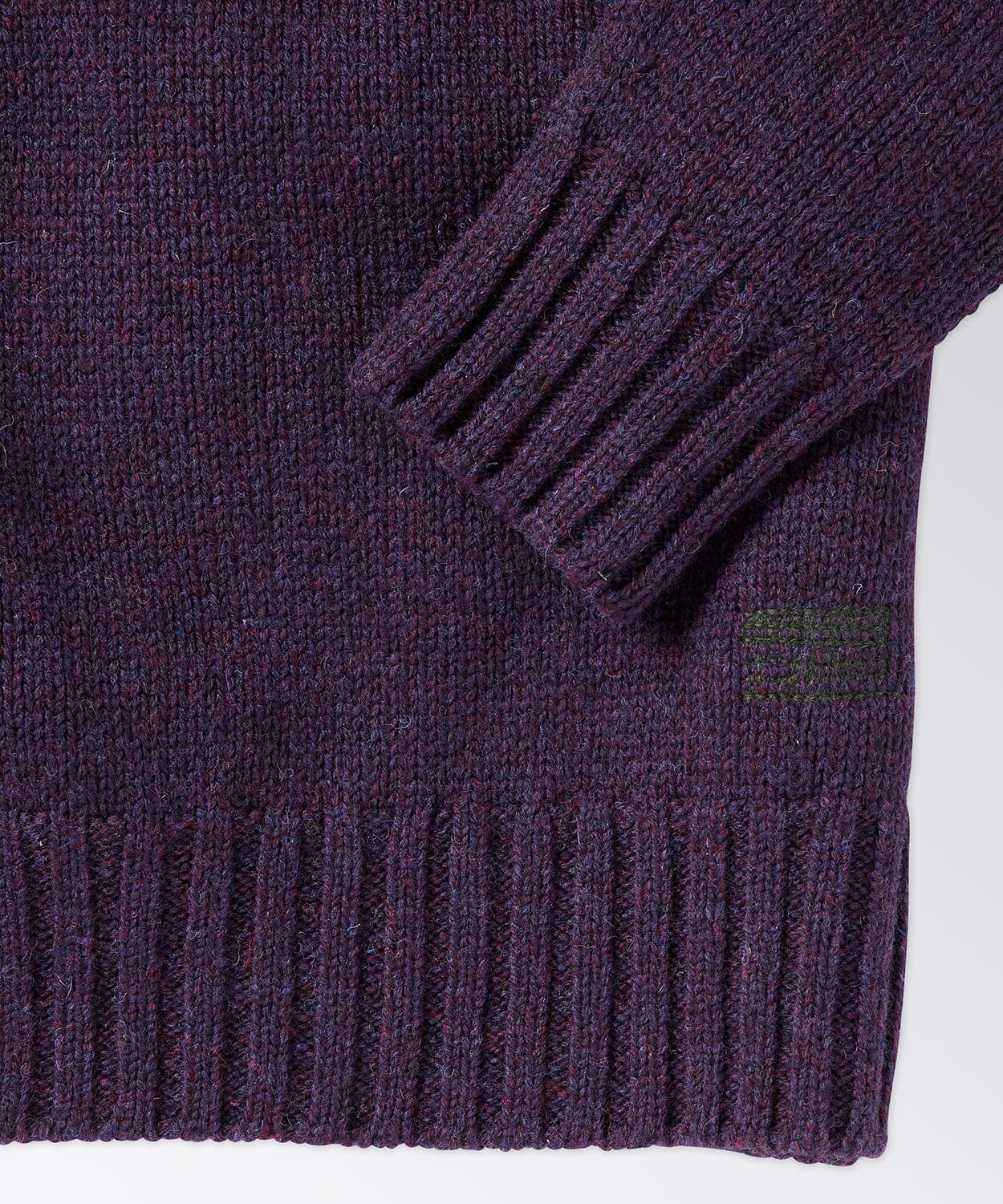 sleeve of a mens crew neck sweater