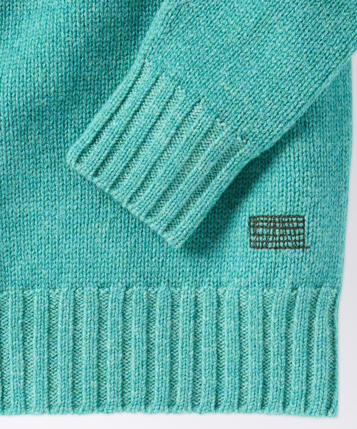 sleeve of a mens crew neck sweater