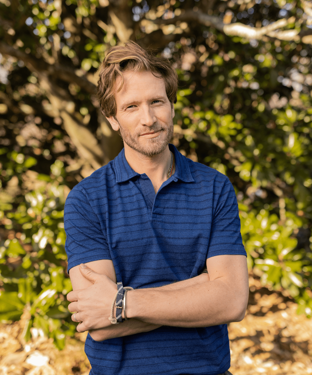 man wearing a blue stripe polo shirt by oobe brand