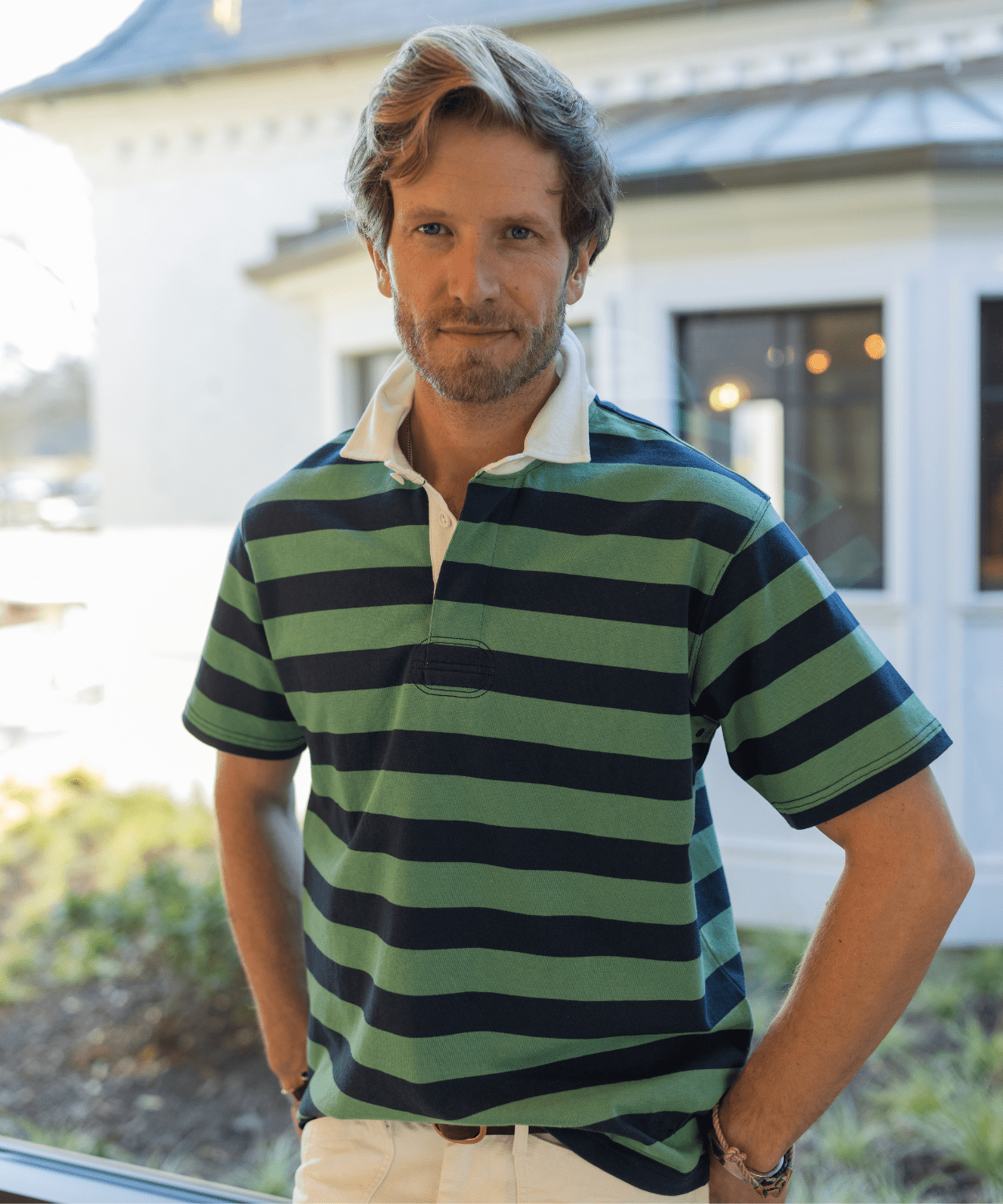 man wearing a green short sleeve rugby shirt