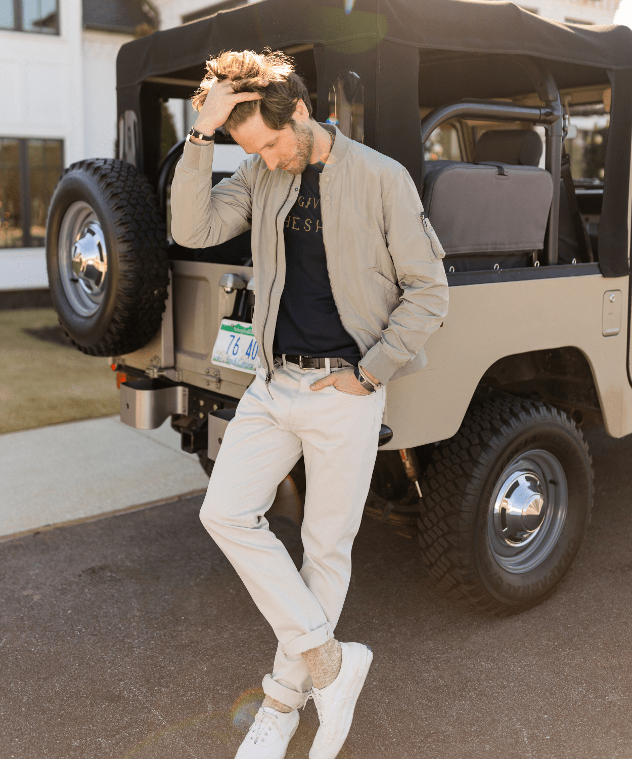 man wearing an oobe brand lightweight flight jacket in tan