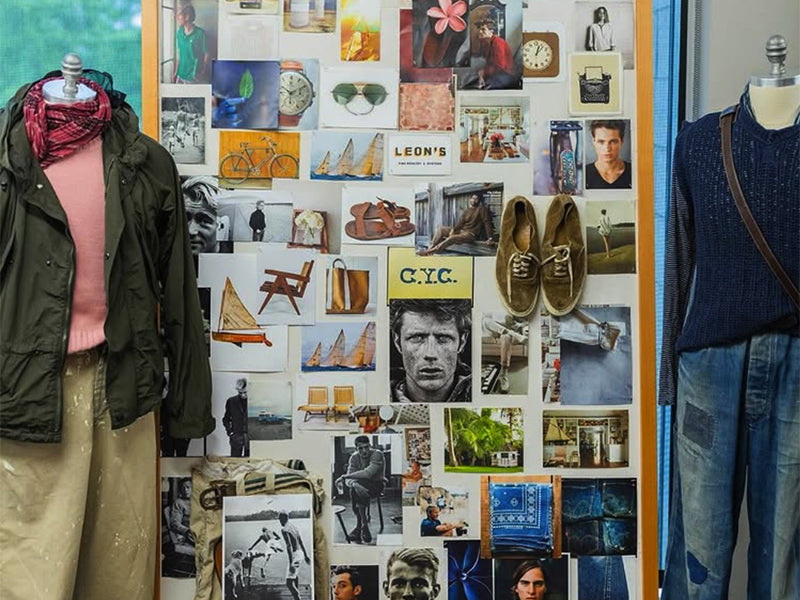 An inspiration board flanked by two mannequins wearing OOBE brand products.