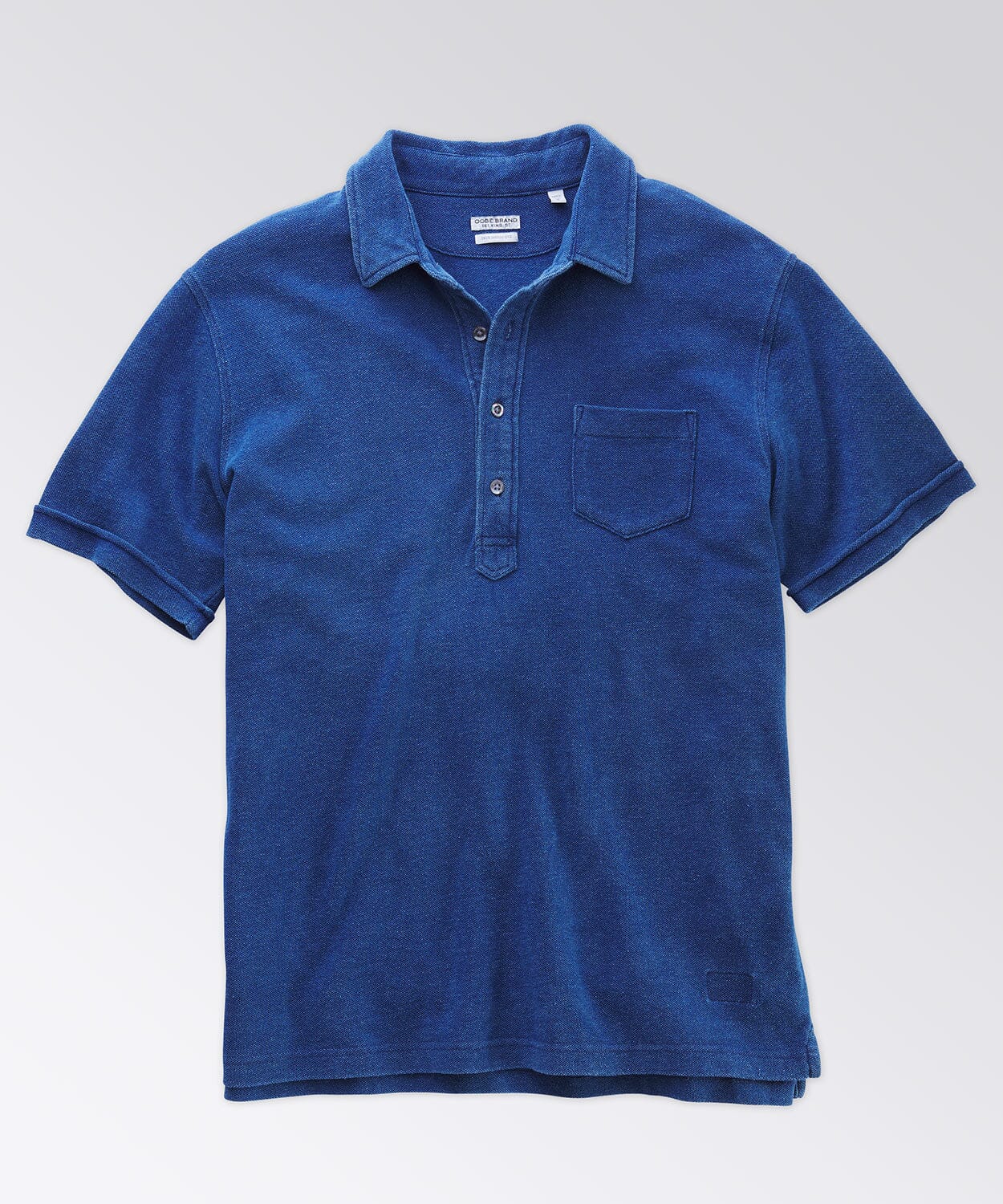 front of a blue polo