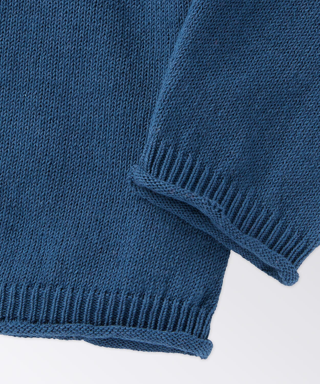 Close Up of Raw Edge Sleeve Opening and Bottom Band