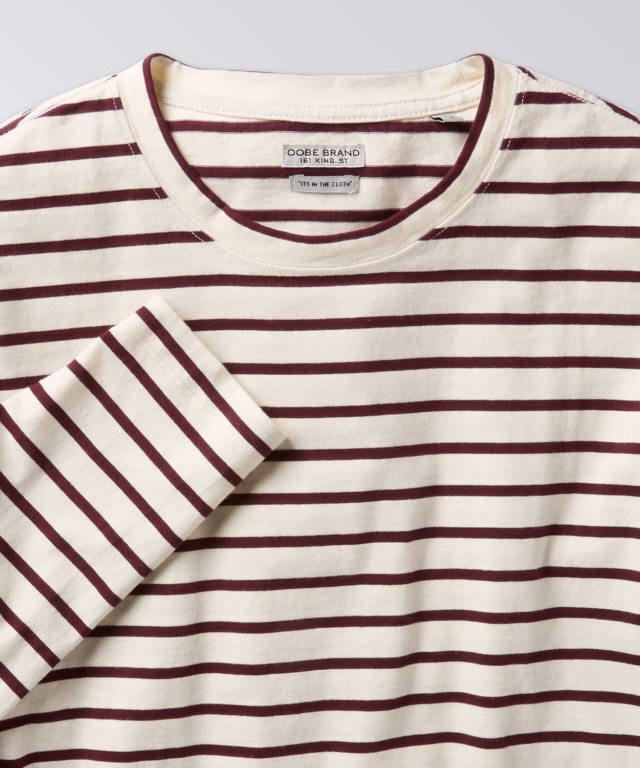 front of a striped tee for men