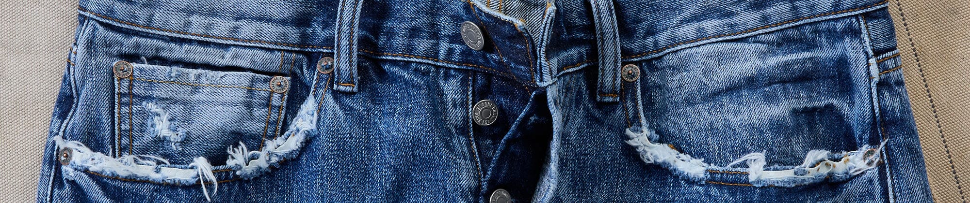 close up image of the top of mens jeans