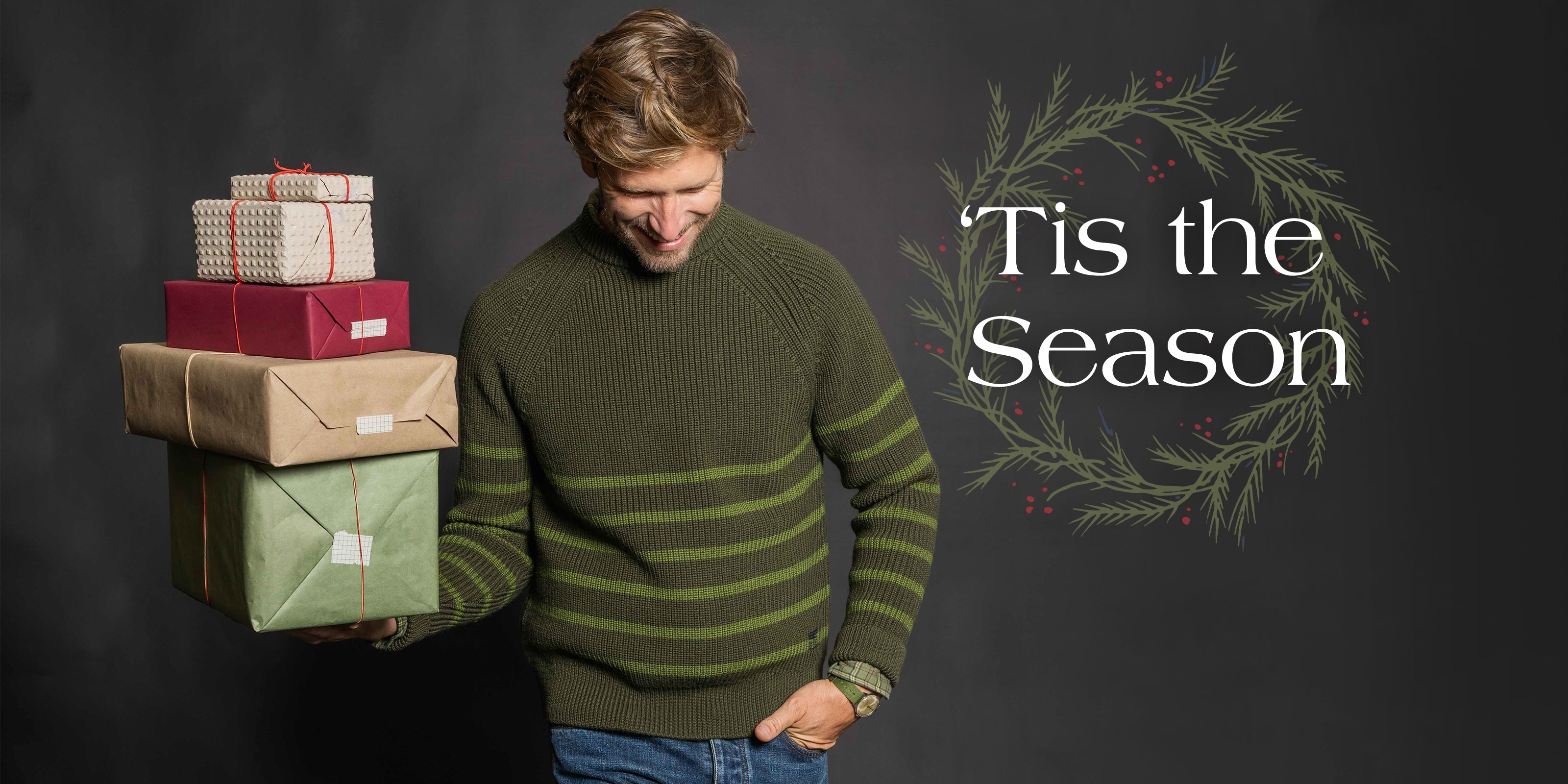 man holding presents and text saying tis the season