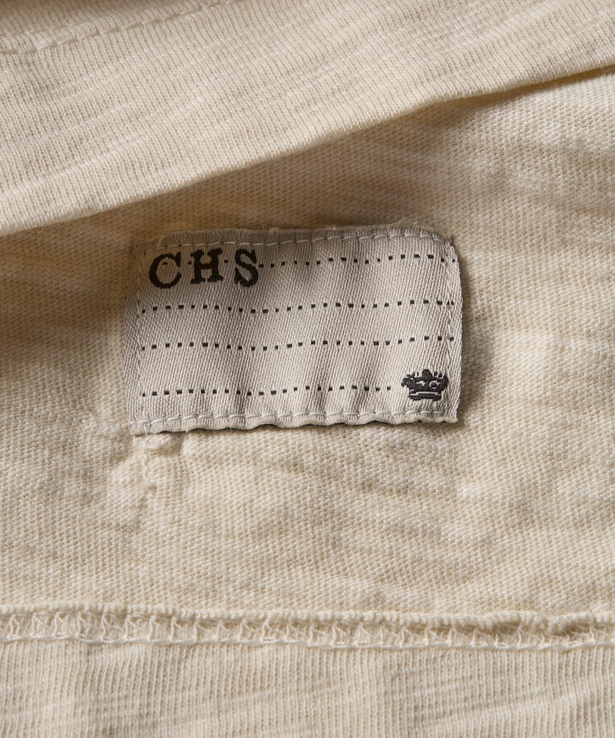 detail of a mens henley shirt