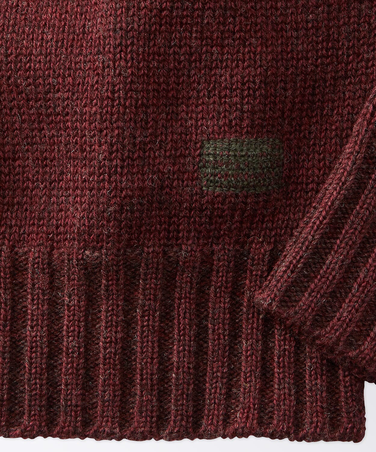 sleeve of a mens crew neck sweater