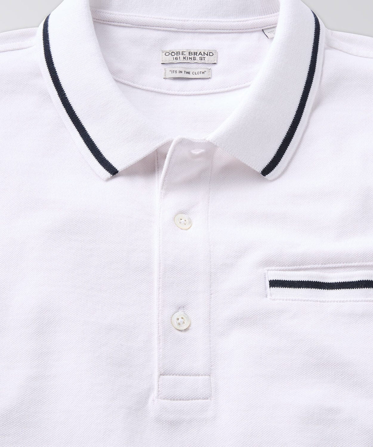 front of a white polo shirt