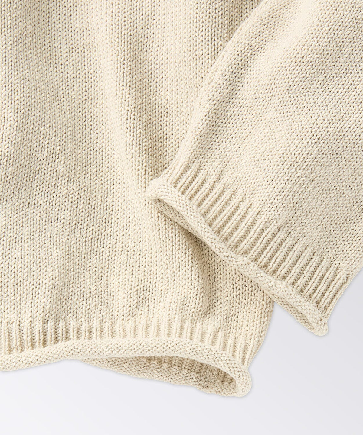 Close Up of Raw Edge Sleeve Opening and Bottom Band