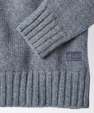 sleeve of a mens crew neck sweater
