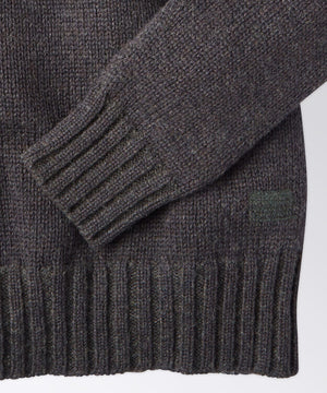 sleeve of a mens crew neck sweater