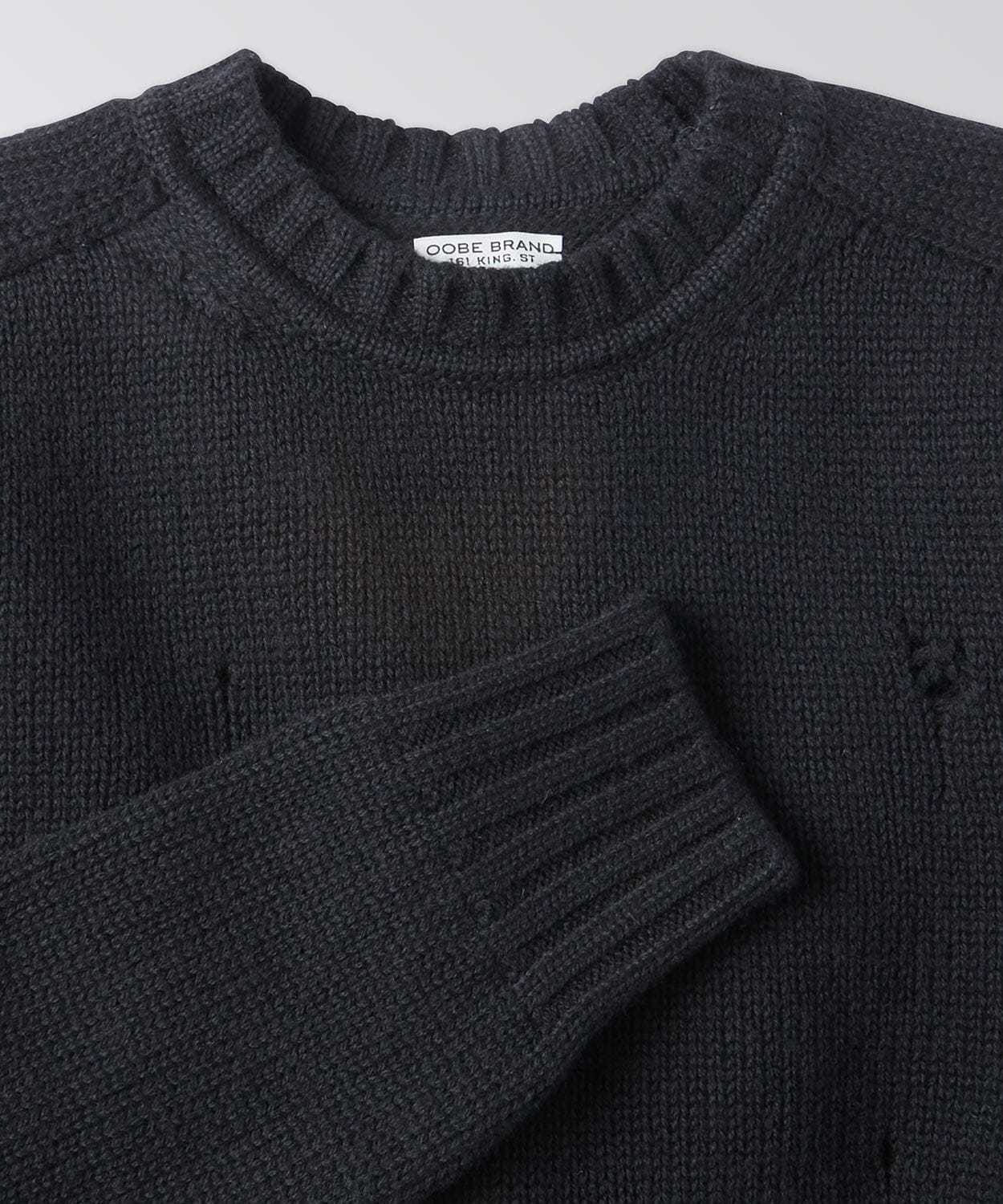 front of a black sweater