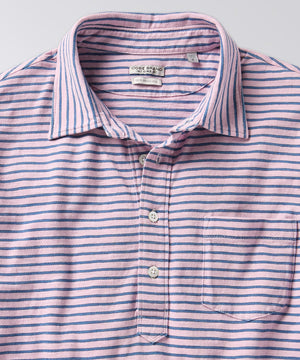 front of a striped polo shirt