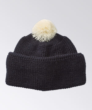 Wool beanie with contrast color pom pom on top