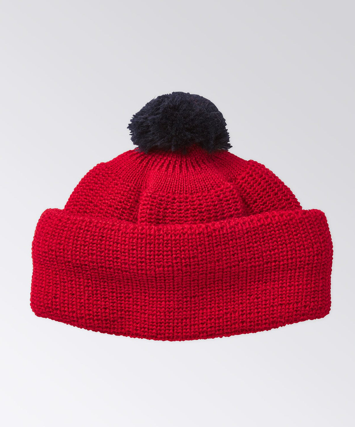 Wool beanie with contrast color pom pom on top